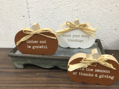 Assorted inspirational pumpkin signs